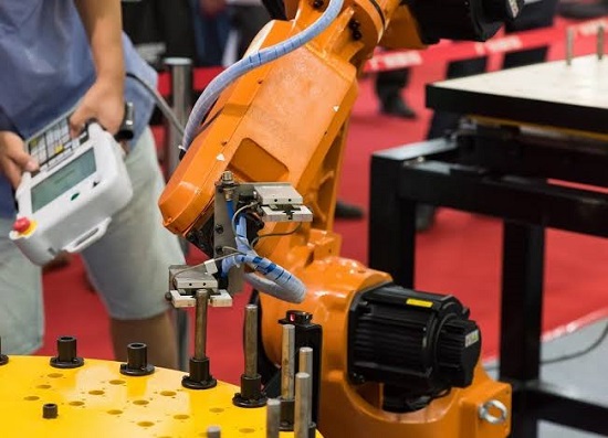 A Senior Technician Operating The Collaborative Robot In Manufacturing Industry.